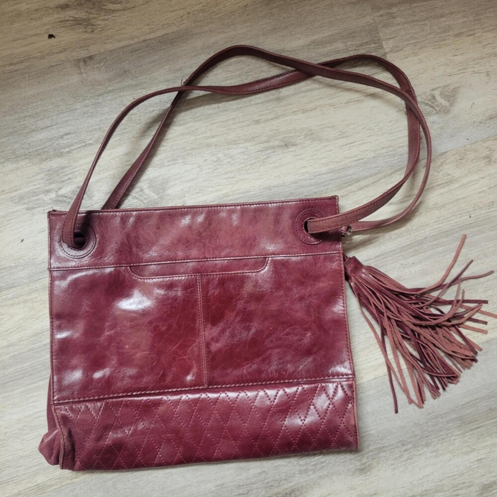 Hobo the original burgundy leather tote with quilted diamond pattern on the bott